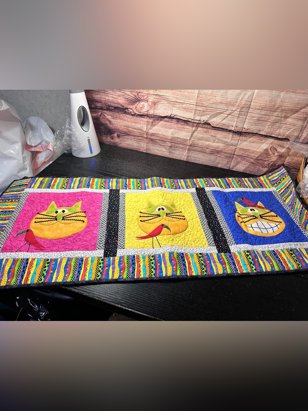 Quilted Multi-color table runner features vibrant feline appliqué work 19x46